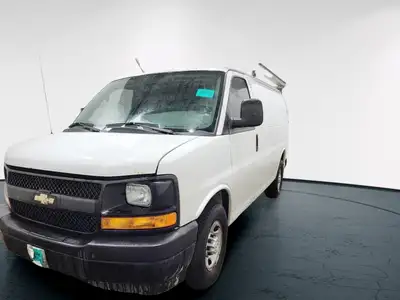 The 2017 Chevrolet Express Cargo Van in a classic white, rear-wheel drive design is tailored for tho...
