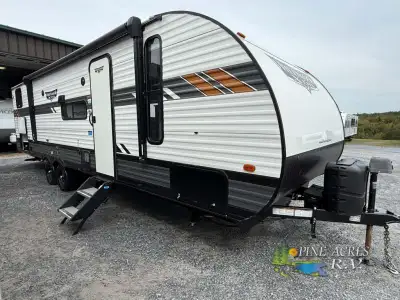 Forest River Wildwood X-Lite travel trailer 273QBXL highlights: Private Bunkhouse Versa Lounge Firep...