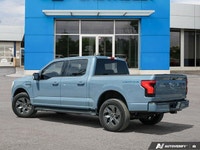 This stunning 2023 Ford F-150 Lightning XLT boasts a powerful dual-motor all-wheel-drive system and... (image 3)