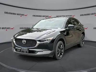 // ACCIDENT FREE!! // Finished in Black with a Burgundy interior, this used 2022 Mazda CX-30 GT w/Tu...