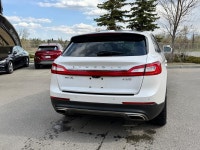 The 2016 MKX Reserve is characterized by its "Split-wing" front grille and a full-width LED taillamp... (image 2)
