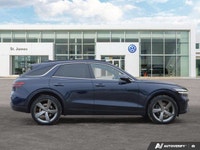 * 21-inch sport alloy wheels, dark-tinted radiator grille, unique front/rear bumpers, and large exha... (image 5)