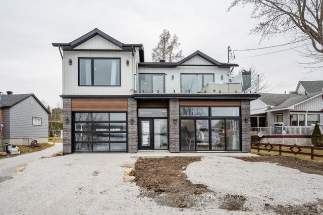 Maison haut de gamme neuve aux abords du Lac Champlain dans Maisons à vendre  à Ville de Montréal
