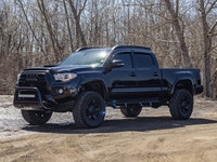 This Toyota is a tough and reliable midsize truck that is built for both everyday driving and off-ro... (image 2)