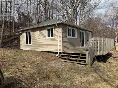Cottage or a beautiful waterfront 1.67 acre lot to build your feature dream home overlooking the St...