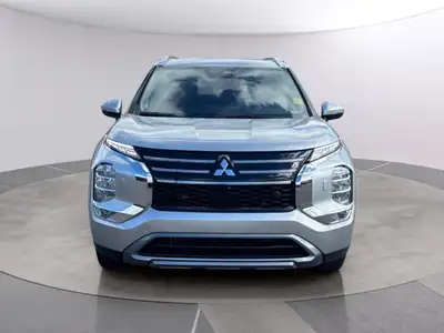 Introducing the 2026 Mitsubishi Outlander Plug-In Hybrid SE S-AWC, gliding in with a captivating sil...