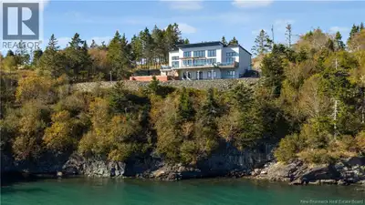 Experience luxury coastal living in this stunning oceanfront executive bungalow set on 5.75 acres of...