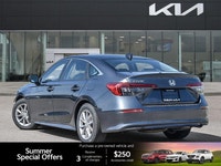 The 2022 Honda Civic Sedan EX, a striking grey 4-door car with a comfortable black interior, redefin... (image 3)