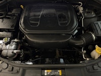 Experience the ultimate fusion of muscle-car attitude and three-row utility in this aggressive SUV,... (image 7)