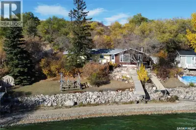 Experience the best of lake living with over 100 feet of prime shoreline offering breathtaking panor...