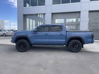 AMVIC Licensed Dealer The 2018 Toyota Tacoma TRD Off Road 4x4 Double Cab, finished in Blazing Blue M... (image 4)