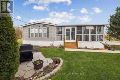 Welcome to 4449 Milburough Line #13 Spruce in beautiful rural Burlington! This charming and well-mai...