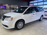 The 2019 Dodge Grand Caravan Canada Value Package in pristine white is the perfect blend of practica... (image 1)