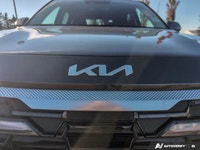 The 2025 Kia Seltos X-Line AWD in a striking gray finish with an automatic transmission offers confi... (image 9)