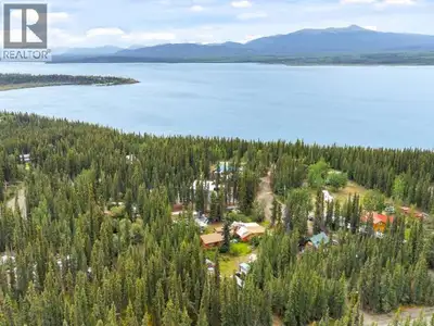 Welcome to 5 Chinook Lane in New Constabulary, Marsh Lake, Yukon. This spacious log cabin has grown...