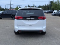 The 2026 Chrysler Grand Caravan SXT in Bright White with a Black interior offers the perfect blend o... (image 4)