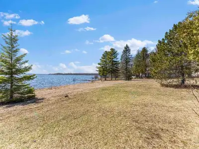 Experience waterfront bliss at Chemin Owl's Landing, an exquisite 40,472 sqft vacant lot poised for...