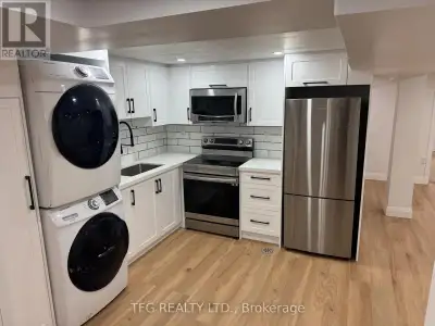Welcome to 906 Hutchison Avenue, Whitby - a beautifully renovated lower-level unit in a legal duplex...
