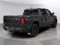 The 2026 Ram 1500 Sport, presented in a sophisticated gray finish, offers powerful 44 capabilities c... (image 4)
