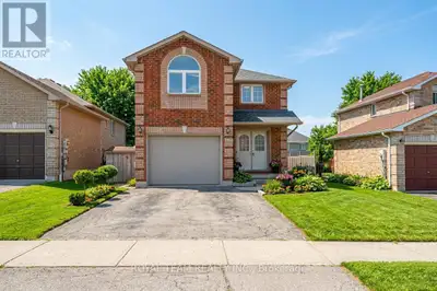 Welcome to this bright and sun-filled home, originally designed by the builder as a four-bedroom lay...