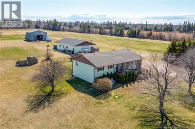 BEAUTIFUL BUNGALOW ON OVER 4 ACRES WITH LARGE WORKSHOP AND SEPARATE STEEL BUILDING! Through the fron...