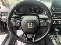 A modern and efficient compact sedan with a refined interior, advanced safety features, and smooth t... (image 9)