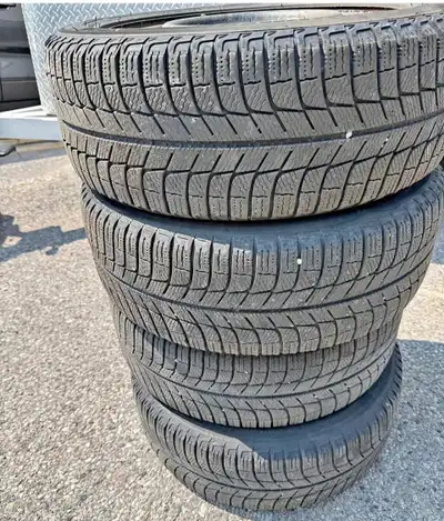 (4) Michelin Snow Tires 205 55 16 mounted on steel rims. Dot 1516 + 80 percent tread, good for many...