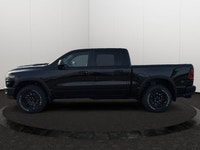 This 2026 RAM 1500 REBEL CREW CAB 4X4 has the following options Lux Leather Trimmed Bucket Seats, Re... (image 1)