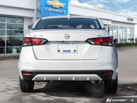 The former daily rental 2024 Nissan Versa SV, dressed in an eye-catching Aspen White TriCoat, presen... (image 4)