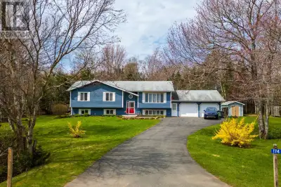 Spacious three plus two bedroom, two bath home with large, attached garage on a wooded lot, minutes...