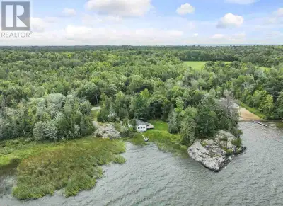 Discover your own private getaway on the pristine shores of Bright Lake. This charming west-facing c...