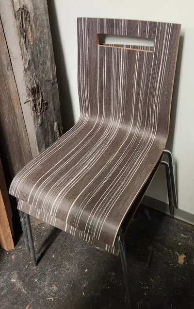 These stylish chairs feature a unique striped design and a convenient handle cutout. This set of cha...