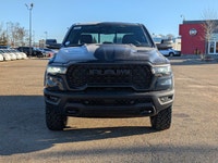 The 2026 Ram 1500 Rebel Crew Cab in Granite Crystal Metallic makes a bold statement with its rugged... (image 9)