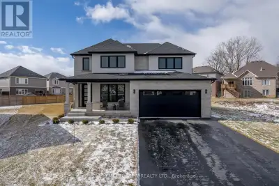 Custom Built Home offers extra large irregular pie shaped lot. Stunning curb appeal with a stone and...