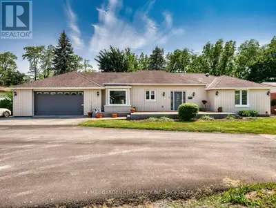 Country living in the north end of St. Catharines on a double-wide, ravine-side luxury property loca...