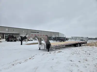 Heavy-duty 102" x 35' all-aluminum gooseneck trailer (30'+5' beavertail) designed for high-capacity...