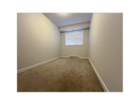 Each suite includes a stainless-steel fridge, stove, dishwasher, and microwave by Whirlpool, as well... (image 8)