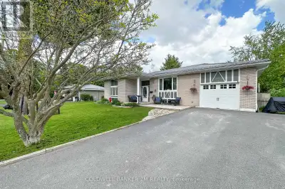 Welcome to this beautifully maintained raised brick bungalow, ideally located on a large 82 x 175 ft...