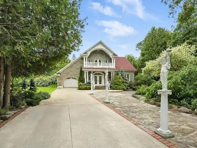 Charming property fenced land with in-ground pool, fish pond, and mature trees. Located on a quiet s...