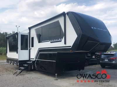 Brinkley Model G toy hauler 3250 highlights: Garage with Loft L-Shaped Sofa 19 Cu. Ft. Refrigerator...