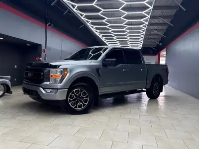 Experience the renowned 2022 Ford F-150 XLT 4x4 SuperCrew in a striking Silver finish, built for bot...