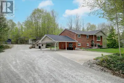 Tucked away on a picturesque 2-acre lot, this fabulous raised bungalow is your own private escape, w...