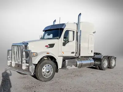 TANDEM AXLES WITH SPEED INTERLOCK, TAPER LEAF SPRINGS, SHOCKS 13,200 LBS. Engine: Paccar