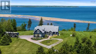 Welcome to 76 Sandview Lane, an exquisite coastal retreat nestled in the serene community of Malagas...