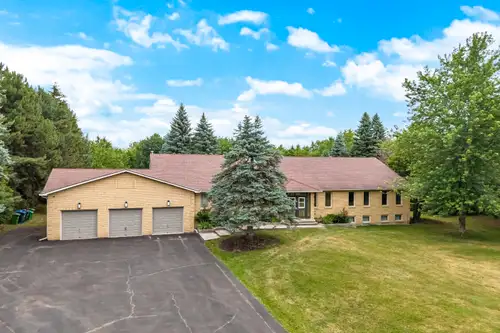 Amazing custom built ranch bungalow on a 2.5 acre pie - shaped ( 287' rear ) wooded ravine lot backi...