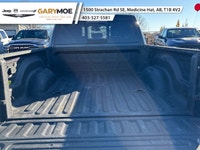 The 2023 Ram 2500 Laramie, in a striking black finish and equipped with a robust 4x4 drivetrain, pro... (image 4)