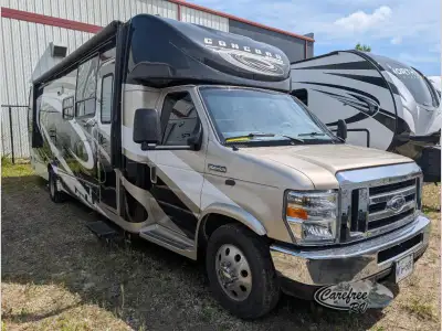 Hit the road with all the comforts of home in this Coachmen Concord class C gas motorhome featuring...