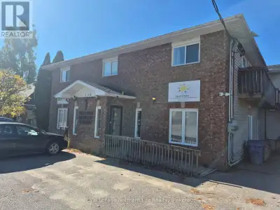 Well, cared 2-storey building. Professional office building with 3 residential units on second level...