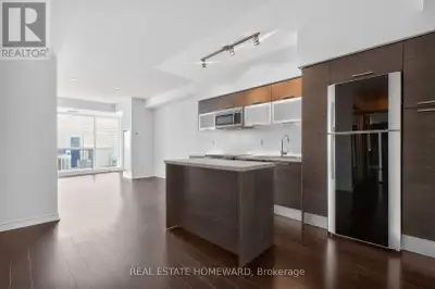 A pristine condition, high floor, south-facing suite at coveted Aura Condos! So much is in like-new...