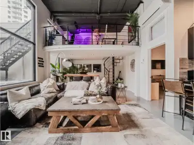 Discover this stunning downtown Edmonton PENTHOUSE LOFT featuring soaring 14-foot ceilings and an im...
